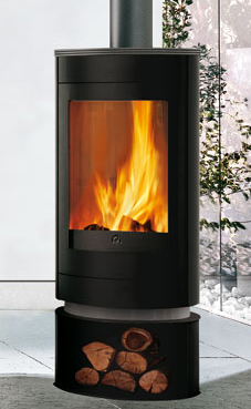 EDILKAMIN modelo ROLLER  6 Kw. Plano fuego de fundición y fuego de refractario. Troncos de leña de máximo 50 cm verticales. Salida humos Ø 15 cm. Giratorio 360°. Revestimiento de acero negro top y decoraciones de acero gris claro