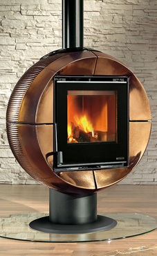 NORDICA-EXTRAFLAME modelo FIREBALL 6 Kw. (blanca infinity , burdeos u oro craquelé) Revestimiento de mayolica Base y cuerpo giratorio en el eje Estufa que gira a 90° Cristal ceramico que resiste hasta 750°C