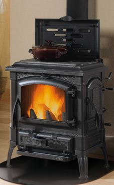 NORDICA-EXTRAFLAME modelo ISETTA CON CERCHI 7 Kw.(estufa de fundición) Estufa totalmente en fundición esmaltada  Placa de hierro fundido alisada  Cristal ceramico que resiste hasta 750° Puerta de carga lateral antracite